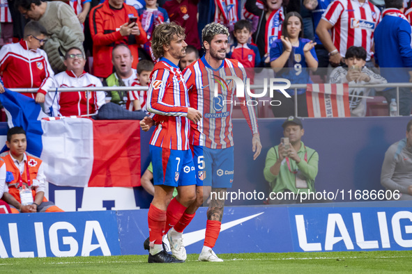 Antoine Griezmann of Atletico de Madrid (L) celebrates his goal by hugging Rodrigo De Paul of Atletico de Madrid (R) during the La Liga EA S...