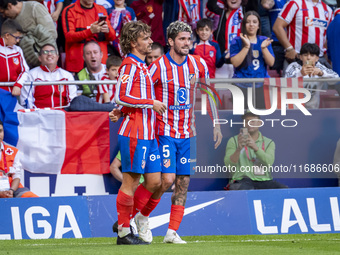 Antoine Griezmann of Atletico de Madrid (L) celebrates his goal by hugging Rodrigo De Paul of Atletico de Madrid (R) during the La Liga EA S...