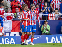 Antoine Griezmann of Atletico de Madrid (L) celebrates his goal by hugging Rodrigo De Paul of Atletico de Madrid (R) during the La Liga EA S...