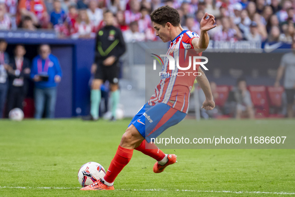 Julian Alvarez of Atletico de Madrid attempts a kick during the La Liga EA Sports 2024/25 football match between Atletico de Madrid and CD L...