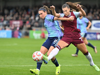 Mariona Caldentey (8 Arsenal) and Seraina Piubel (77 West Ham) challenge for the ball during the Barclays FA Women's Super League match betw...