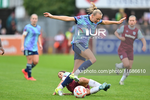 Frida Maanum (12 Arsenal) is challenged by Katrina Gorry (22 West Ham) during the Barclays FA Women's Super League match between West Ham Un...