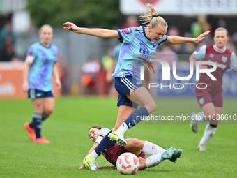 Frida Maanum (12 Arsenal) is challenged by Katrina Gorry (22 West Ham) during the Barclays FA Women's Super League match between West Ham Un...