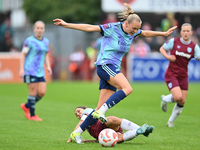 Frida Maanum (12 Arsenal) is challenged by Katrina Gorry (22 West Ham) during the Barclays FA Women's Super League match between West Ham Un...