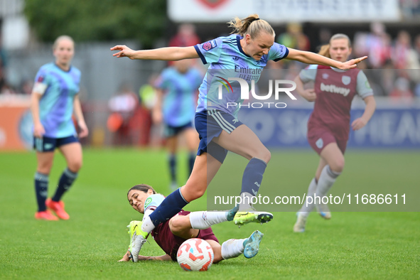 Frida Maanum (12 Arsenal) is challenged by Katrina Gorry (22 West Ham) during the Barclays FA Women's Super League match between West Ham Un...