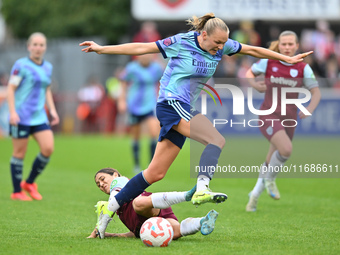 Frida Maanum (12 Arsenal) is challenged by Katrina Gorry (22 West Ham) during the Barclays FA Women's Super League match between West Ham Un...