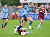 Frida Maanum (12 Arsenal) is challenged by Katrina Gorry (22 West Ham) during the Barclays FA Women's Super League match between West Ham Un...