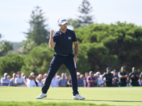 Julien Guerrier of France celebrates a par putt on the 18th green, leading to a play-off, during day four of the Estrella Damm N.A. Andaluci...