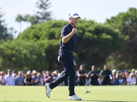 Julien Guerrier of France celebrates a par putt on the 18th green, leading to a play-off, during day four of the Estrella Damm N.A. Andaluci...