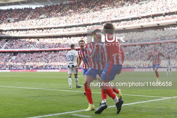 In Madrid, Spain, on October 20, Antoine Griezmann of Atletico de Madrid and Giuliano Simeone of Atletico de Madrid celebrate a goal during...