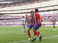 In Madrid, Spain, on October 20, Antoine Griezmann of Atletico de Madrid and Giuliano Simeone of Atletico de Madrid celebrate a goal during...