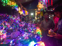 Vendors sell decorative lights before the Diwali festival inside an electronics market in Kolkata, India, on October 20, 2024. (