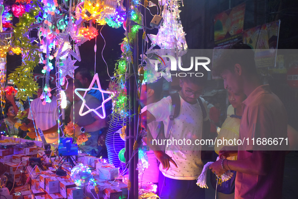 People buy decorative lights before the Diwali festival inside an electronics market in Kolkata, India, on October 20, 2024. 