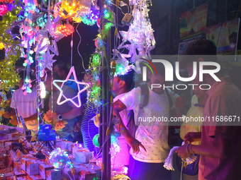 People buy decorative lights before the Diwali festival inside an electronics market in Kolkata, India, on October 20, 2024. (