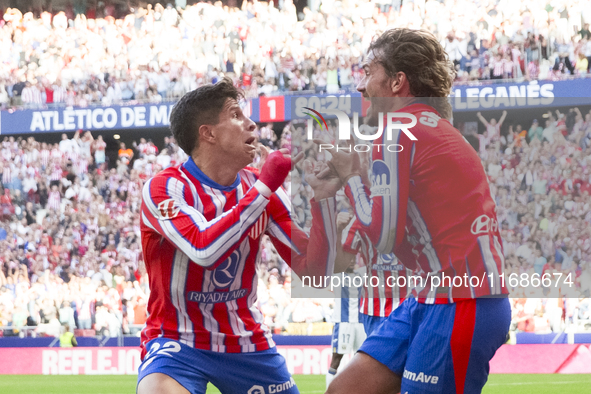 In Madrid, Spain, on October 20, Antoine Griezmann of Atletico de Madrid and Giuliano Simeone of Atletico de Madrid celebrate a goal during...