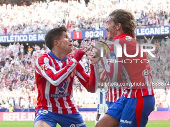 In Madrid, Spain, on October 20, Antoine Griezmann of Atletico de Madrid and Giuliano Simeone of Atletico de Madrid celebrate a goal during...