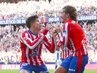 In Madrid, Spain, on October 20, Antoine Griezmann of Atletico de Madrid and Giuliano Simeone of Atletico de Madrid celebrate a goal during...