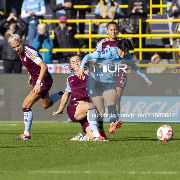 Aoba Fujino #20 of Manchester City W.F.C. is tackled by the opponent during the Barclays FA Women's Super League match between Manchester Ci...