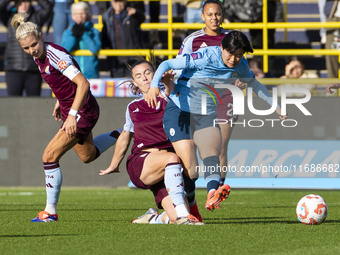 Aoba Fujino #20 of Manchester City W.F.C. is tackled by the opponent during the Barclays FA Women's Super League match between Manchester Ci...