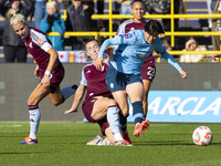 Aoba Fujino #20 of Manchester City W.F.C. is tackled by the opponent during the Barclays FA Women's Super League match between Manchester Ci...