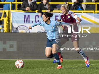 Aoba Fujino #20 of Manchester City W.F.C. is challenged by Rachel Daly #9 of Aston Villa W.F.C during the Barclays FA Women's Super League m...