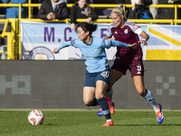 Aoba Fujino #20 of Manchester City W.F.C. is challenged by Rachel Daly #9 of Aston Villa W.F.C during the Barclays FA Women's Super League m...