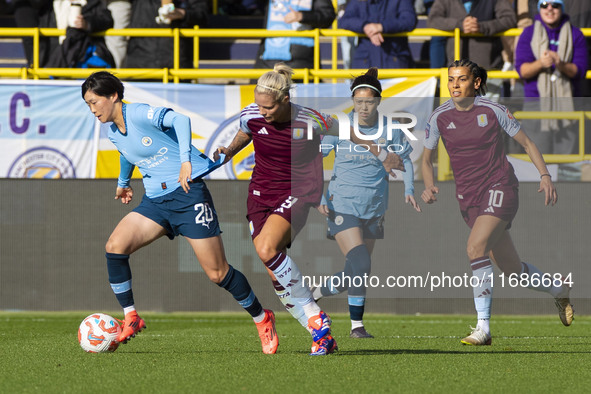 Aoba Fujino #20 of Manchester City W.F.C. is challenged by Rachel Daly #9 of Aston Villa W.F.C during the Barclays FA Women's Super League m...