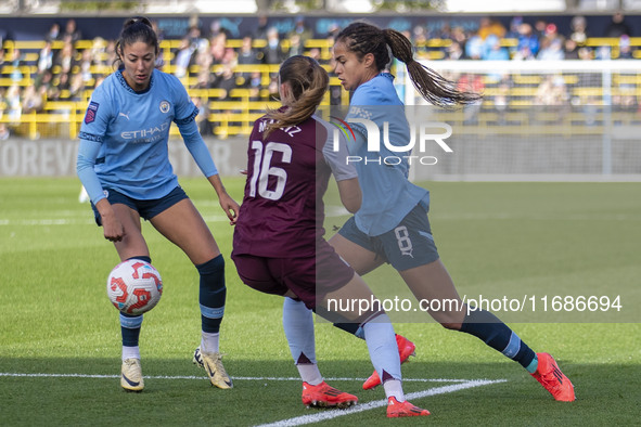 Mary Fowler #8 of Manchester City W.F.C. is challenged by Noelle Maritz #16 of Aston Villa W.F.C. during the Barclays FA Women's Super Leagu...