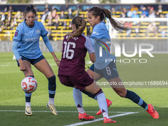 Mary Fowler #8 of Manchester City W.F.C. is challenged by Noelle Maritz #16 of Aston Villa W.F.C. during the Barclays FA Women's Super Leagu...