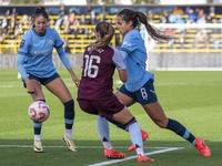 Mary Fowler #8 of Manchester City W.F.C. is challenged by Noelle Maritz #16 of Aston Villa W.F.C. during the Barclays FA Women's Super Leagu...