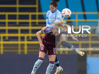 Katie Robinson #11 of Aston Villa W.F.C. engages in an aerial challenge with Leila Ouahabi #15 of Manchester City W.F.C. during the Barclays...