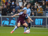 Leila Ouahabi #15 of Manchester City W.F.C. challenges the opponent during the Barclays FA Women's Super League match between Manchester Cit...