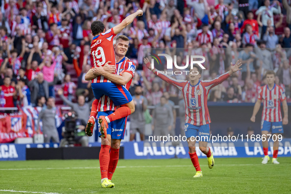 Alexander Sorloth of Atletico de Madrid (C) celebrates his goal with Julian Alvarez (L) and Giuliano Simeone (R) during the La Liga EA Sport...