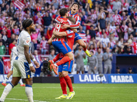 Alexander Sorloth of Atletico de Madrid (C) celebrates his goal with Julian Alvarez (L) and Giuliano Simeone (R) during the La Liga EA Sport...