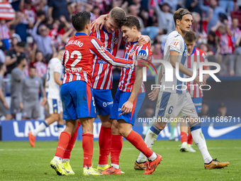 Alexander Sorloth of Atletico de Madrid (C) celebrates his goal with Julian Alvarez (R) and Giuliano Simeone (L) during the La Liga EA Sport...