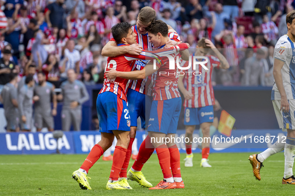 Alexander Sorloth of Atletico de Madrid (C) celebrates his goal with Julian Alvarez (R) and Giuliano Simeone (L) during the La Liga EA Sport...