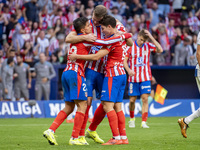 Alexander Sorloth of Atletico de Madrid (C) celebrates his goal with Julian Alvarez (R) and Giuliano Simeone (L) during the La Liga EA Sport...