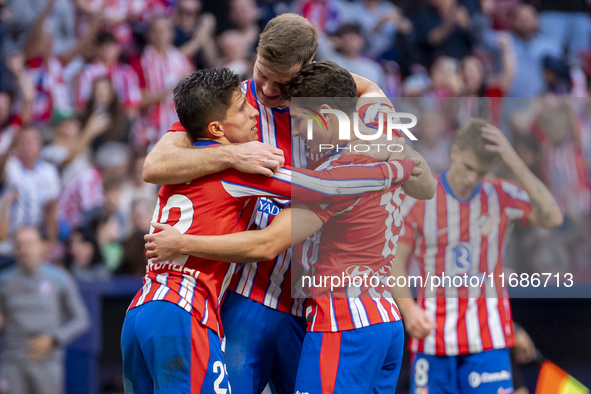 Alexander Sorloth of Atletico de Madrid (C) celebrates his goal with Julian Alvarez (R) and Giuliano Simeone (L) during the La Liga EA Sport...