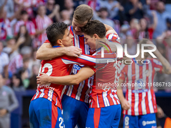 Alexander Sorloth of Atletico de Madrid (C) celebrates his goal with Julian Alvarez (R) and Giuliano Simeone (L) during the La Liga EA Sport...