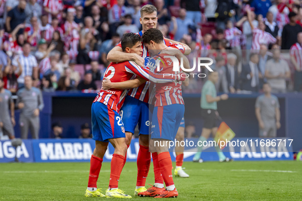 Alexander Sorloth of Atletico de Madrid (C) celebrates his goal with Julian Alvarez (R) and Giuliano Simeone (L) during the La Liga EA Sport...