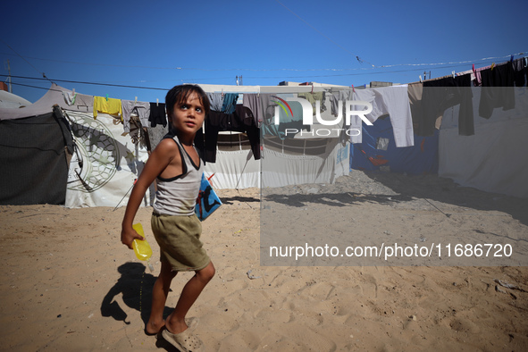 Displaced Palestinians are seen in a temporary camp in Khan Yunis, Gaza Strip, on October 20, 2024, amid the ongoing war in the Palestinian...