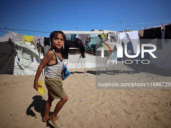 Displaced Palestinians are seen in a temporary camp in Khan Yunis, Gaza Strip, on October 20, 2024, amid the ongoing war in the Palestinian...