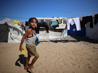 Displaced Palestinians are seen in a temporary camp in Khan Yunis, Gaza Strip, on October 20, 2024, amid the ongoing war in the Palestinian...