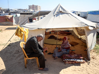 Displaced Palestinians are seen in a temporary camp in Khan Yunis, Gaza Strip, on October 20, 2024, amid the ongoing war in the Palestinian...