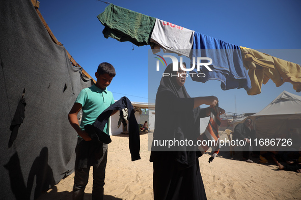 Displaced Palestinians are seen in a temporary camp in Khan Yunis, Gaza Strip, on October 20, 2024, amid the ongoing war in the Palestinian...