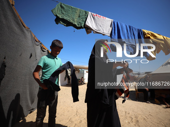 Displaced Palestinians are seen in a temporary camp in Khan Yunis, Gaza Strip, on October 20, 2024, amid the ongoing war in the Palestinian...