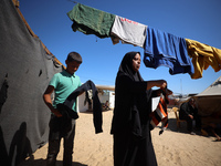 Displaced Palestinians are seen in a temporary camp in Khan Yunis, Gaza Strip, on October 20, 2024, amid the ongoing war in the Palestinian...