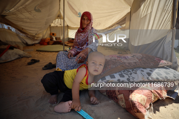 Displaced Palestinians are seen in a temporary camp in Khan Yunis, Gaza Strip, on October 20, 2024, amid the ongoing war in the Palestinian...