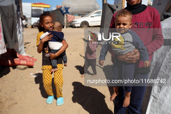 Displaced Palestinians are seen in a temporary camp in Khan Yunis, Gaza Strip, on October 20, 2024, amid the ongoing war in the Palestinian...