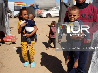 Displaced Palestinians are seen in a temporary camp in Khan Yunis, Gaza Strip, on October 20, 2024, amid the ongoing war in the Palestinian...